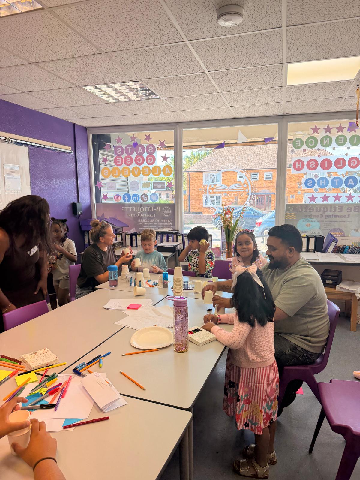 Families enjoying a hands-on craft activity together