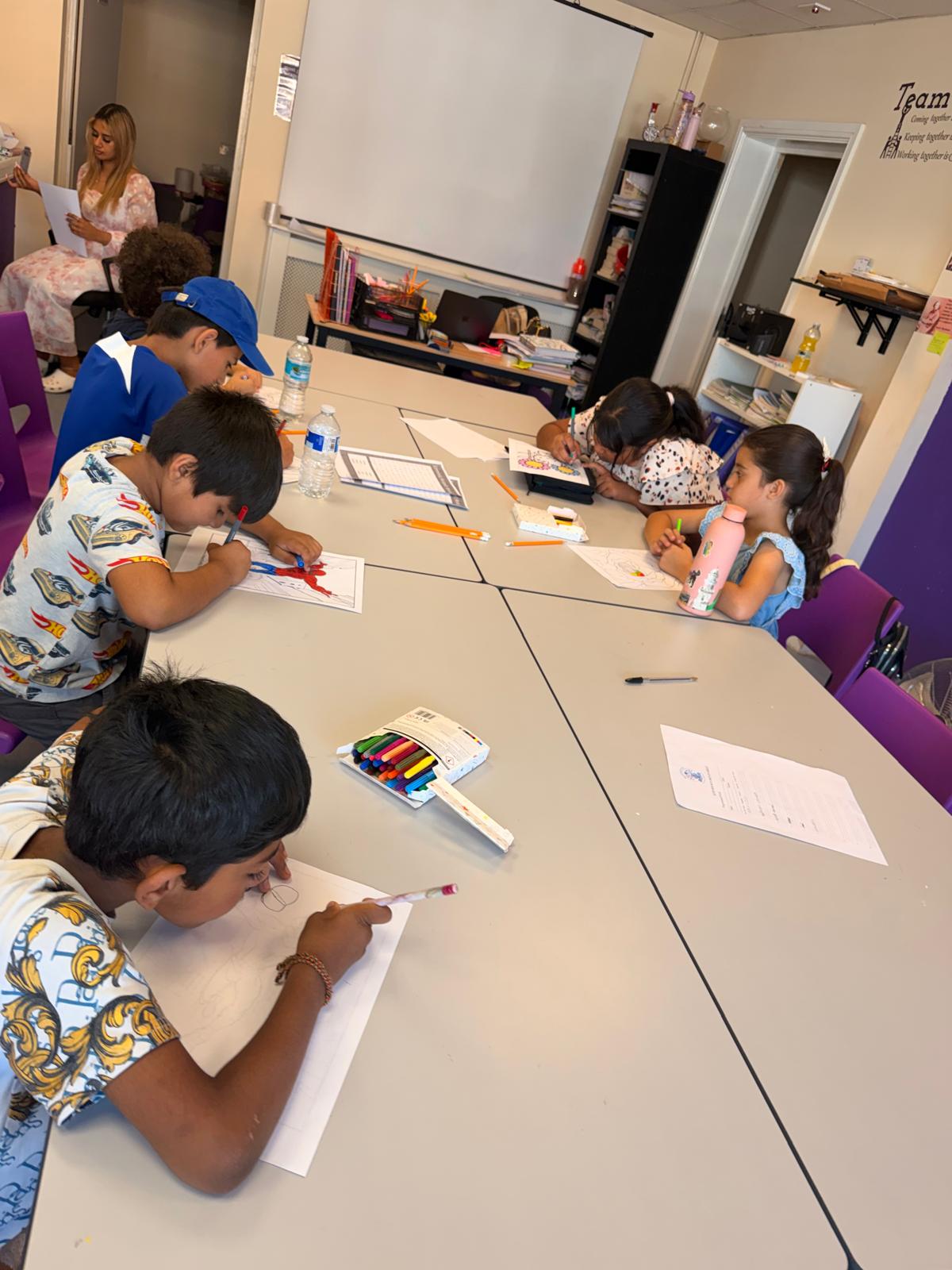 Children colouring and drawing during a group session